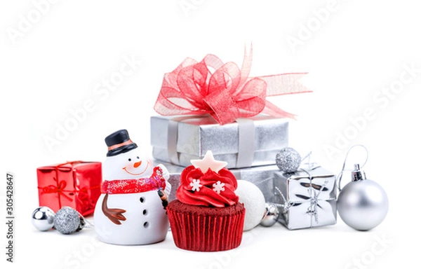 Obraz Merry Christmas and Happy New Year with red cupcake and snowman statuette and silver gift boxes