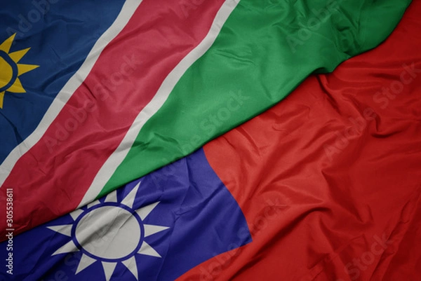 Fototapeta waving colorful flag of taiwan and national flag of namibia.