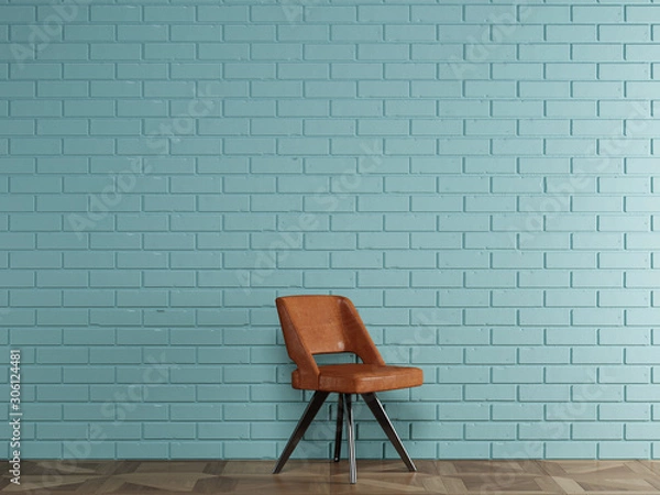 Fototapeta Orange leather chair in modern style standing in front of blue brick wall with copy space