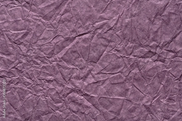 Fototapeta Crumpled paper texture in dark violet color as part of your new greeting gift.