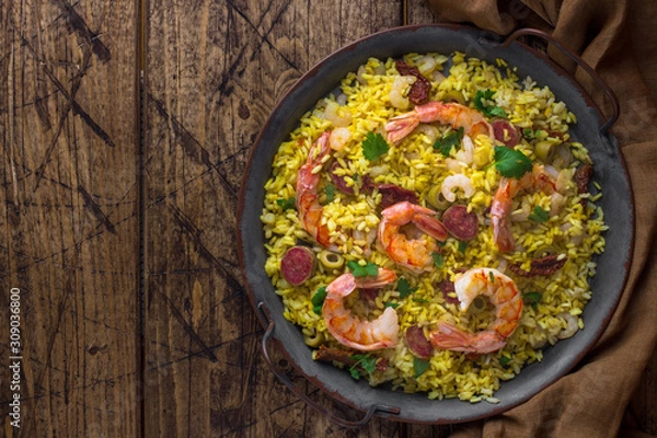 Fototapeta Paella with shrimps and chorizo