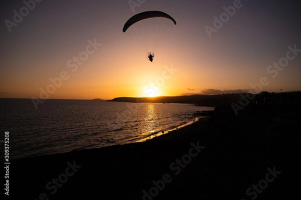 Fototapeta Paragliding During Sunset