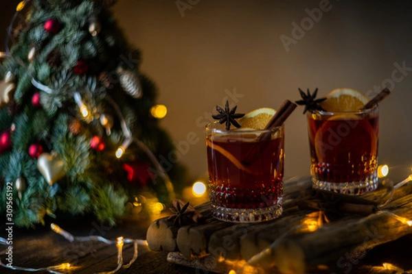 Fototapeta Traditional christmas mulled red wine and fruits.