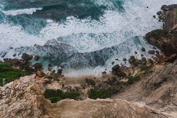 Fototapeta The rocky coast of the island of Bali. Wave, the ocean, evening, clouds.