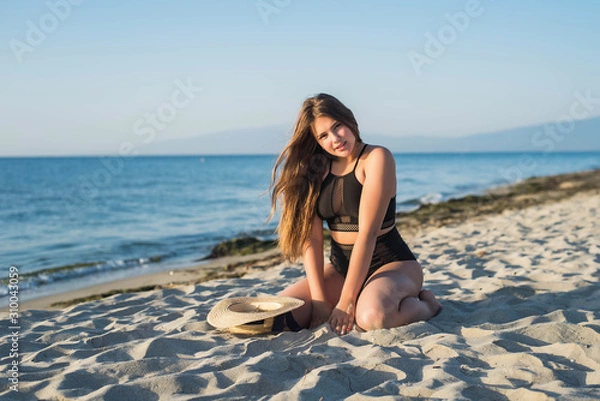 Fototapeta Cheerful plus size teenage girl enjoying the beach. smiling, happy, positive emotion, summer style.