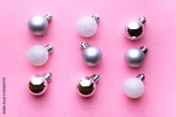 Fototapeta Christmas decoration balls isolated on pink background. Xmas pattern. Flat lay. Pattern winter bubble concept