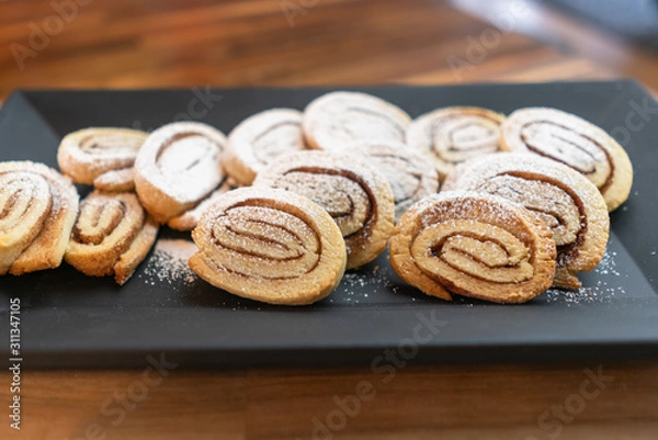 Fototapeta Homemade cinnamon roll cookies on a plate