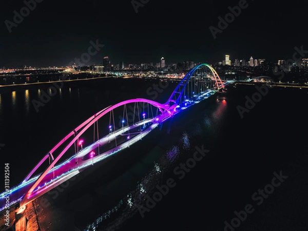 Fototapeta Crescent Bridge - landmark of New Taipei, Taiwan with beautiful illumination at night, photography in New Taipei, Taiwan.