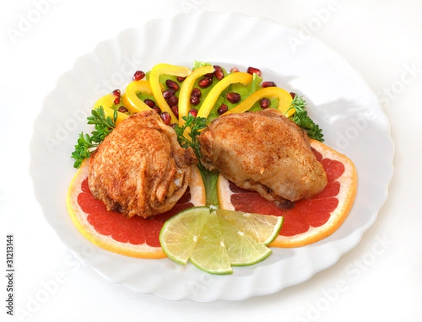 Fototapeta Fried chicken leg with lemon and cucumber