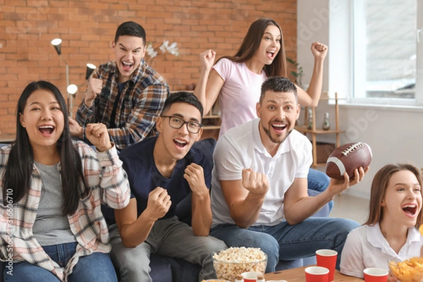 Fototapeta Group of fans watching rugby on TV