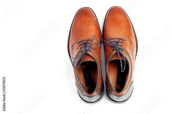 Fototapeta luxurious male brown and blue leather shoes isolated on a white, top view