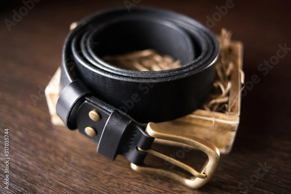 Fototapeta Handmade black wide leather belt for men and women