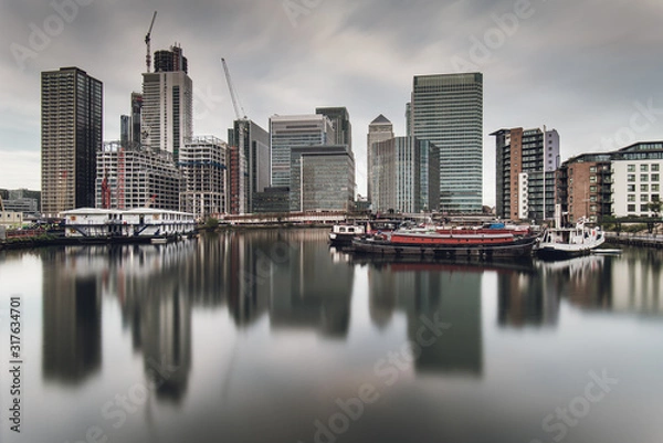 Fototapeta Financial District Canary Wharf in London Reflected in Water