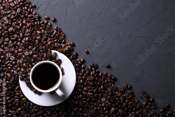 Fototapeta Coffee cup and beans on old grey kitchen beton , rock table. Top view with copyspace for your text