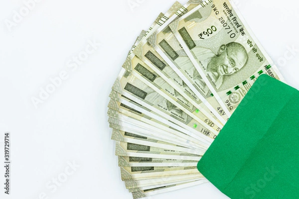 Fototapeta New Indian 500 rupees, 500 rupees notes, Five Hundred New Indian Currency  in green envelope texture on white background, Success and got profit from business.