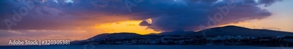 Fototapeta  Panorama of Golden Sunset Over The Mountains Silhouette Of A Mountain Range Against The Sky At Sunset