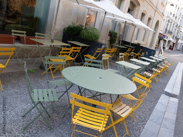 Fototapeta Street view with cafe terrace in Avignon city france