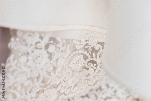 Obraz pattern on a wedding dress with beads. close up. white wedding g