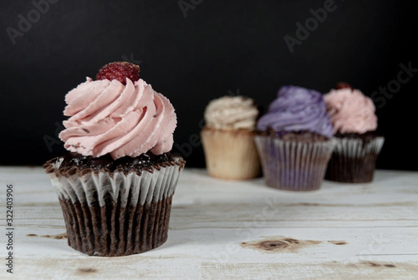 Fototapeta Cupcakes on dark background