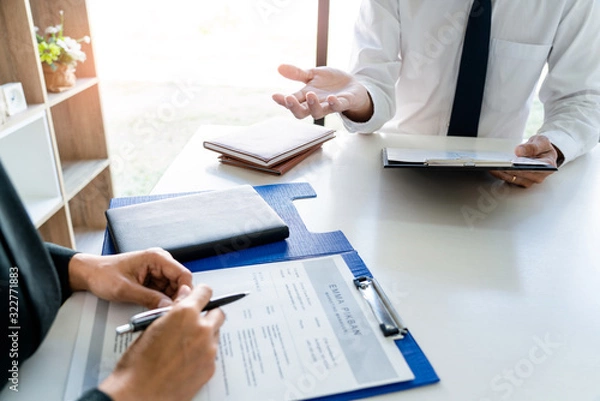 Fototapeta Job interview, Corporate business Employer or recruiter around the table during interviewing recruitment process concept.