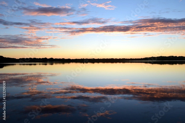 Fototapeta Amanecer y reflejos