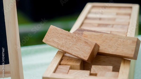 Fototapeta wooden block  stacked on green background