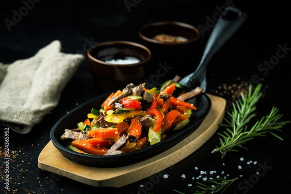 Fototapeta Steamed vegetables with beef and sesame seeds