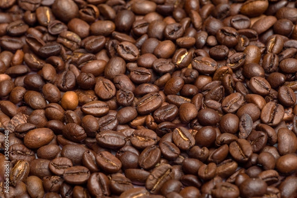 Fototapeta Coffee beans background. Coffee beans close up on the table. Coffe concept