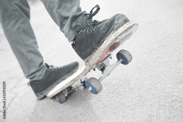 Obraz Boy rides on skateboard in the asphalt.