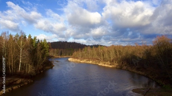 Fototapeta landscape with river and blue sky near Turaida castle in Latvia 