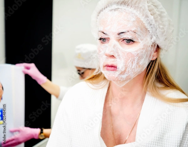 Fototapeta Mature woman with anesthetic mask on her face stressed before co