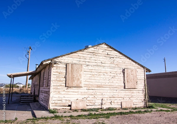 Fototapeta Old Weathered Home With Peeling Paint & Boarded Up Windows