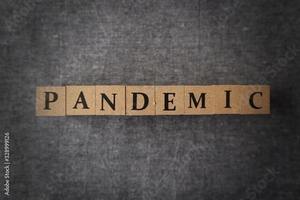 Fototapeta 'PANDEMIC' word made with wooden blocks