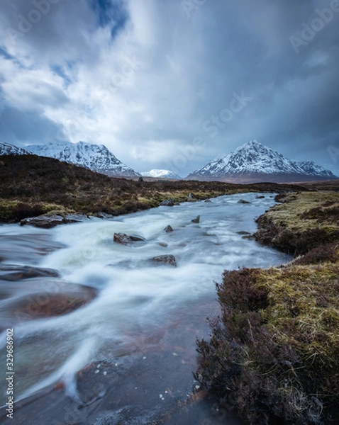 Fototapeta the river coupall waterfalls on rannoch moor showing buachaille etive mor in the background as the entrance to glencoe valley in winter