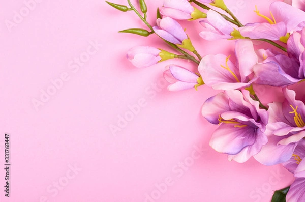 Fototapeta Decorative flowers on pink background composition.