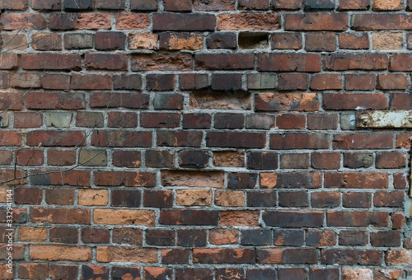 Fototapeta The old charred brick wall - texture background