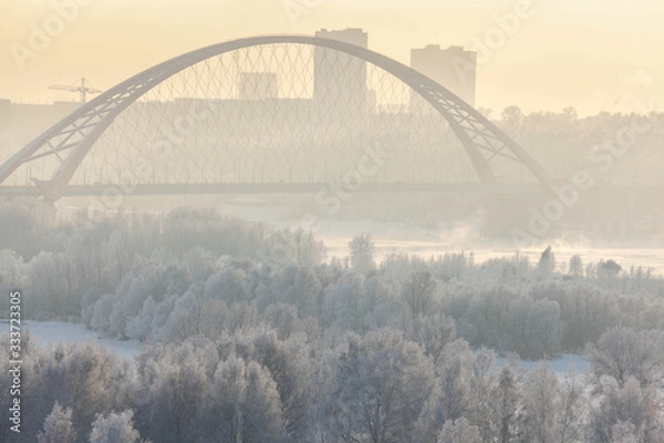 Fototapeta Bugrinsky bridge in winter foggy morning