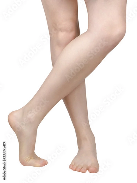 Fototapeta bare feet of a girl with flat feet, barefoot, legs crossed and one standing on a toe, the inside of the foot is visible, front view isolated on white background