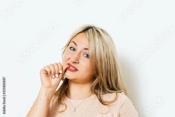 Fototapeta Woman bites his nails