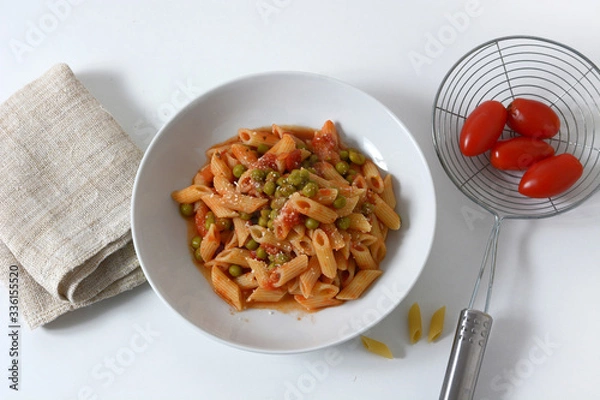 Fototapeta pasta with tomato sauce and peas