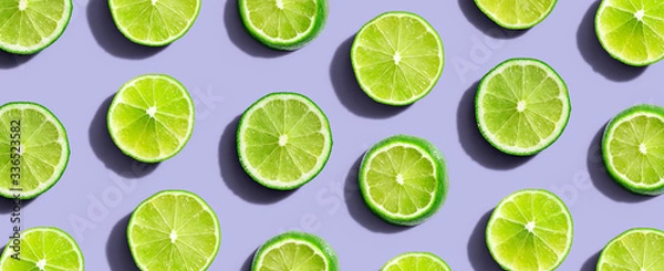 Fototapeta Fresh green limes overhead view - flat lay