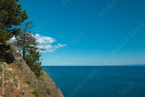 Fototapeta Irkust region, Listvyanka village, Lake Baika. 
Beautiful landscape of the lake from the steep slopes of the mountains. Clear blue sky, calm water