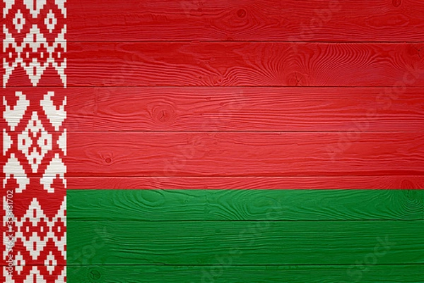 Fototapeta Belarus flag painted on old wood plank background. Brushed natural light knotted wooden board texture. Wooden texture background flag of Belarus.