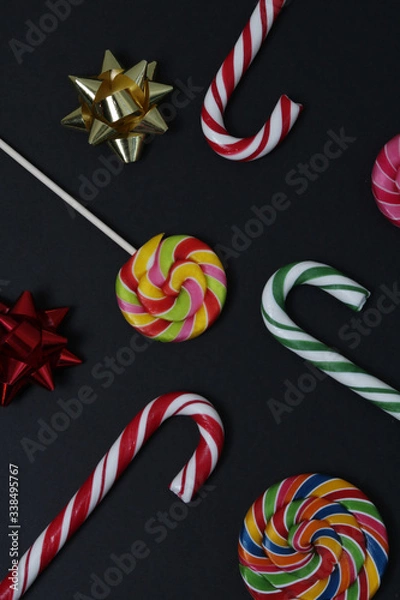 Fototapeta multi-colored sweets, decorations on a black background