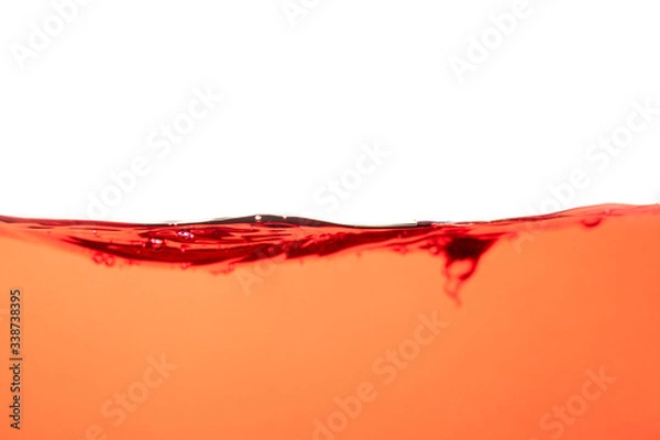 Fototapeta Red water splash and air bubbles on white background