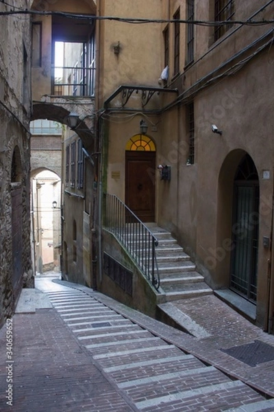 Fototapeta Ancient alleyway in Perugia historic city centre, Italy