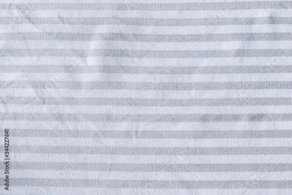 Fototapeta Natural gray striped linen fabric texture. Rough crumpled burlap textile background