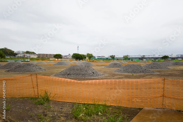 Fototapeta 災害後の河川敷補修工事現場