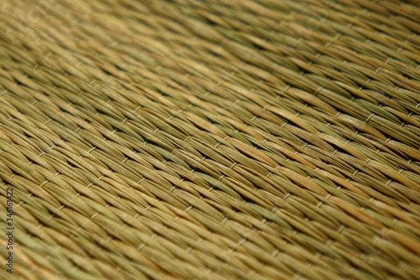 Fototapeta Straw mat woven texture. Selective focus background. 