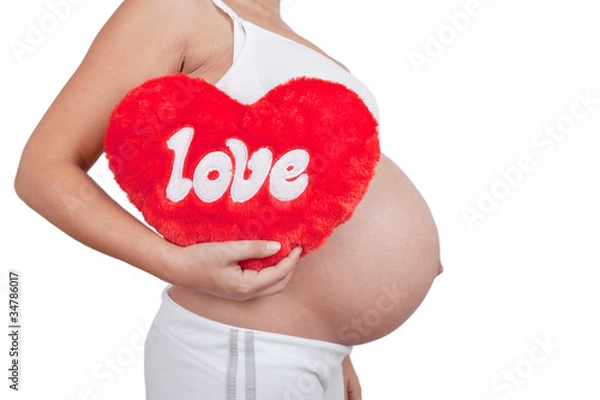 Fototapeta Pregnant woman hold red hart with love in hands